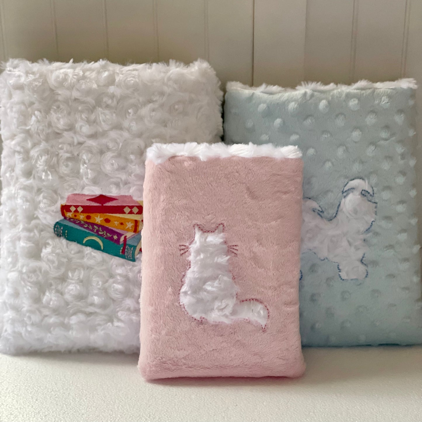 Sizes Large, Medium, and small shown each includes a large pocket.
-Small (6" x 8") smaller books
-Medium (8" x 10") traditional paperback book
Check the listing for sizing availability.
-Large (9" x 11") hardcover book