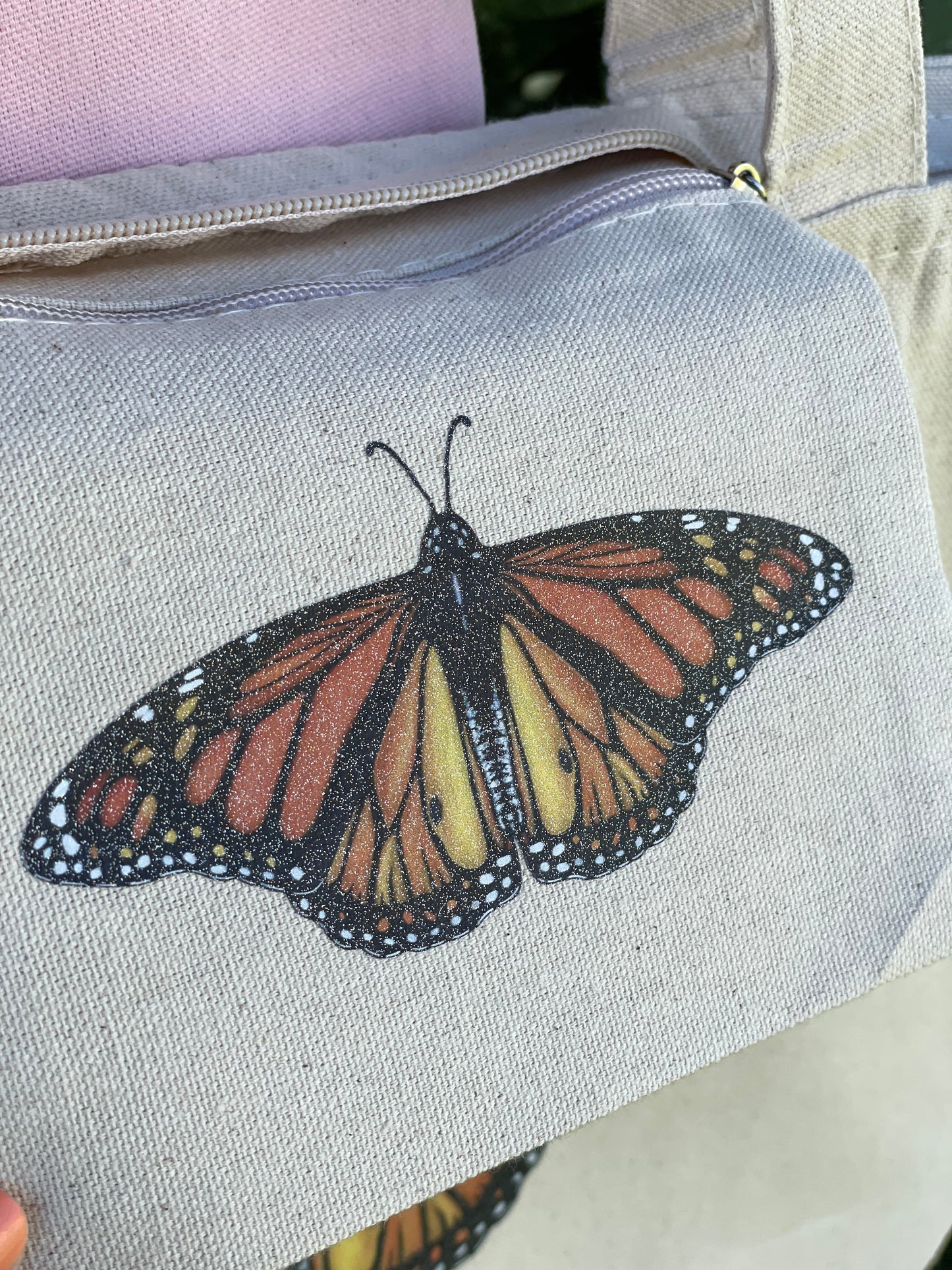 Sparkle Monarch on inside pocket of tote bag approximately 4x4 inches.