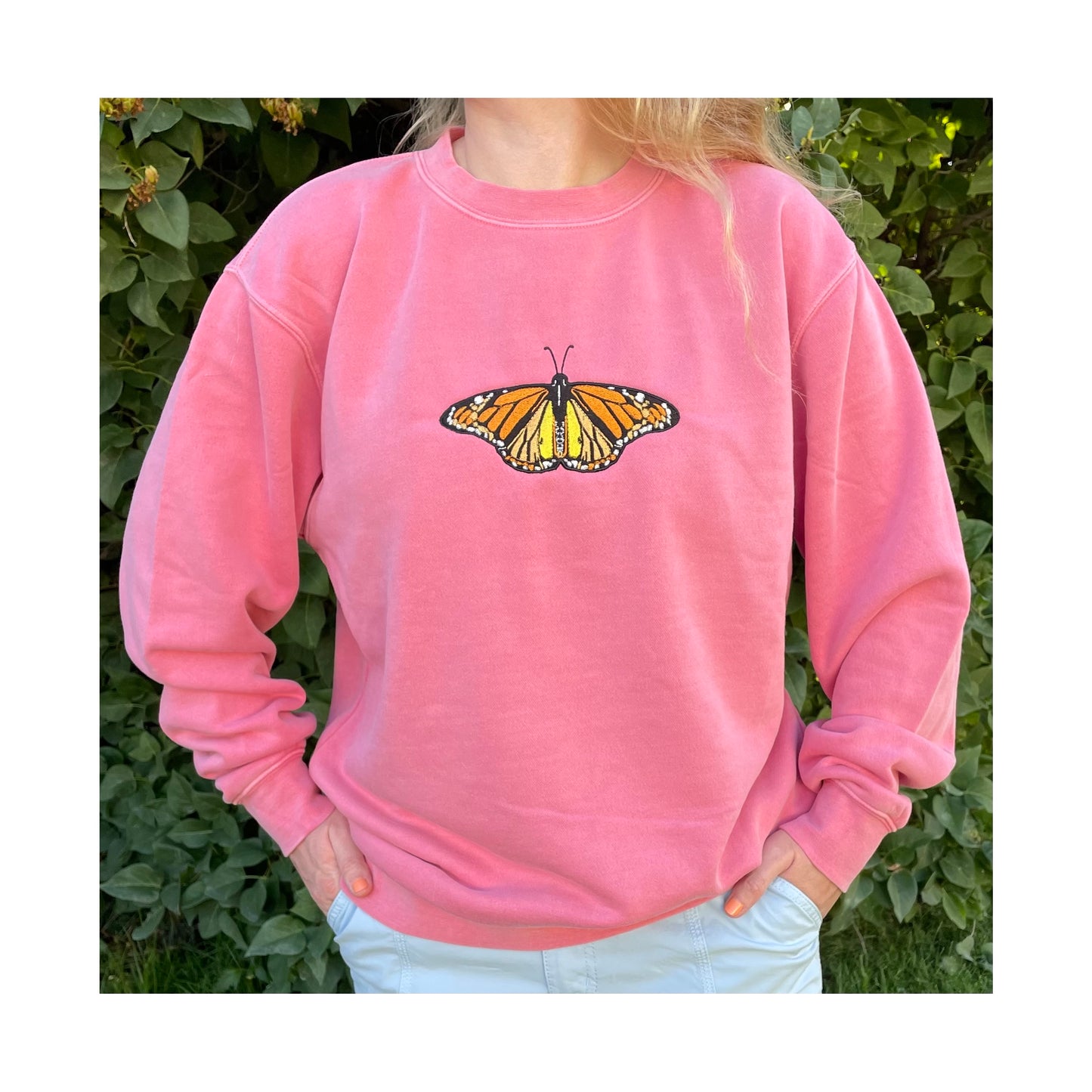 These crewneck sweatshirts are pigment dyed which adds a beautiful unique look. The crewnecks are embroidered with high quality thread that leaves a beautiful sparkle when it hits the sun. Embroidered with a beautiful monarch butterfly. Center chest embroidered graphic, unisex fit, mid-weight fabric, material: 80% cotton/ 20% polyester blend, colors: pink, light blue, or forrest green. Sizes S, M, L, XL, 2XL, 3XL  available.