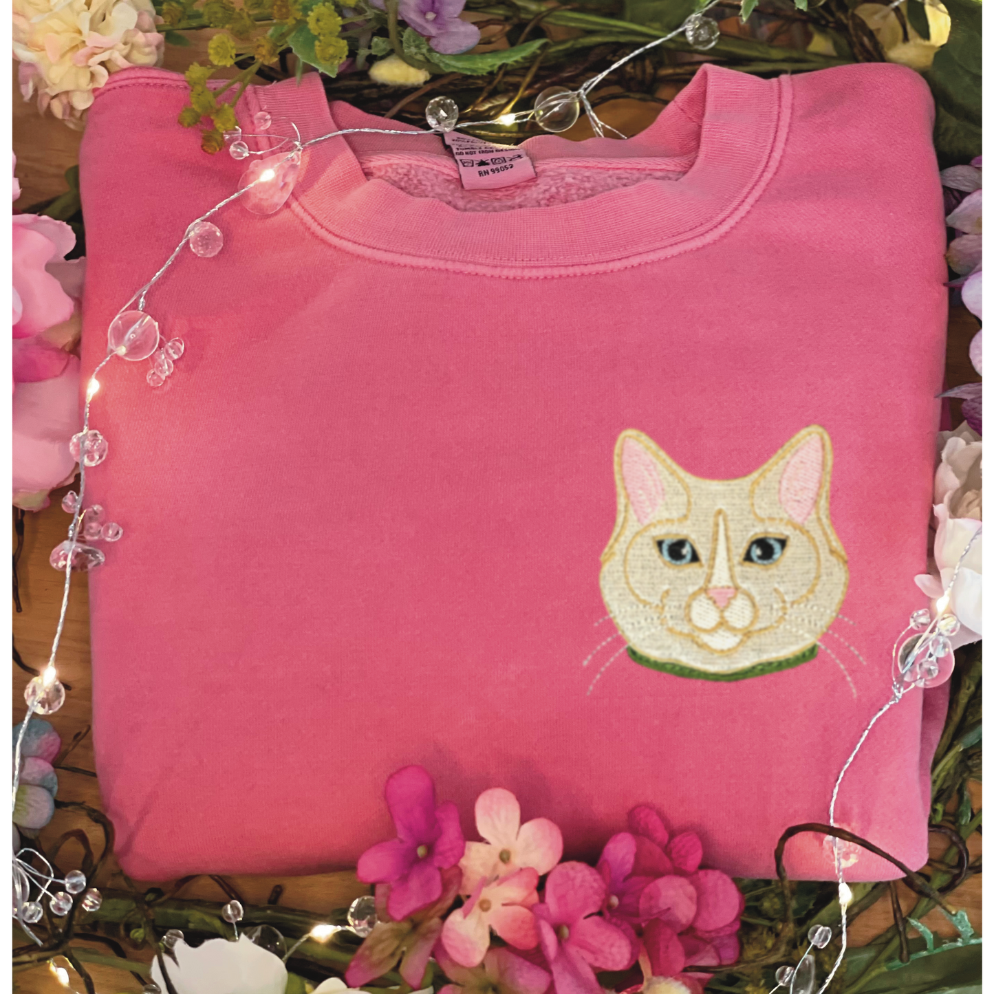 Flame Point Cat left chest embroidered 4x4 inch on pigment pink. Sizes S-3XL available.