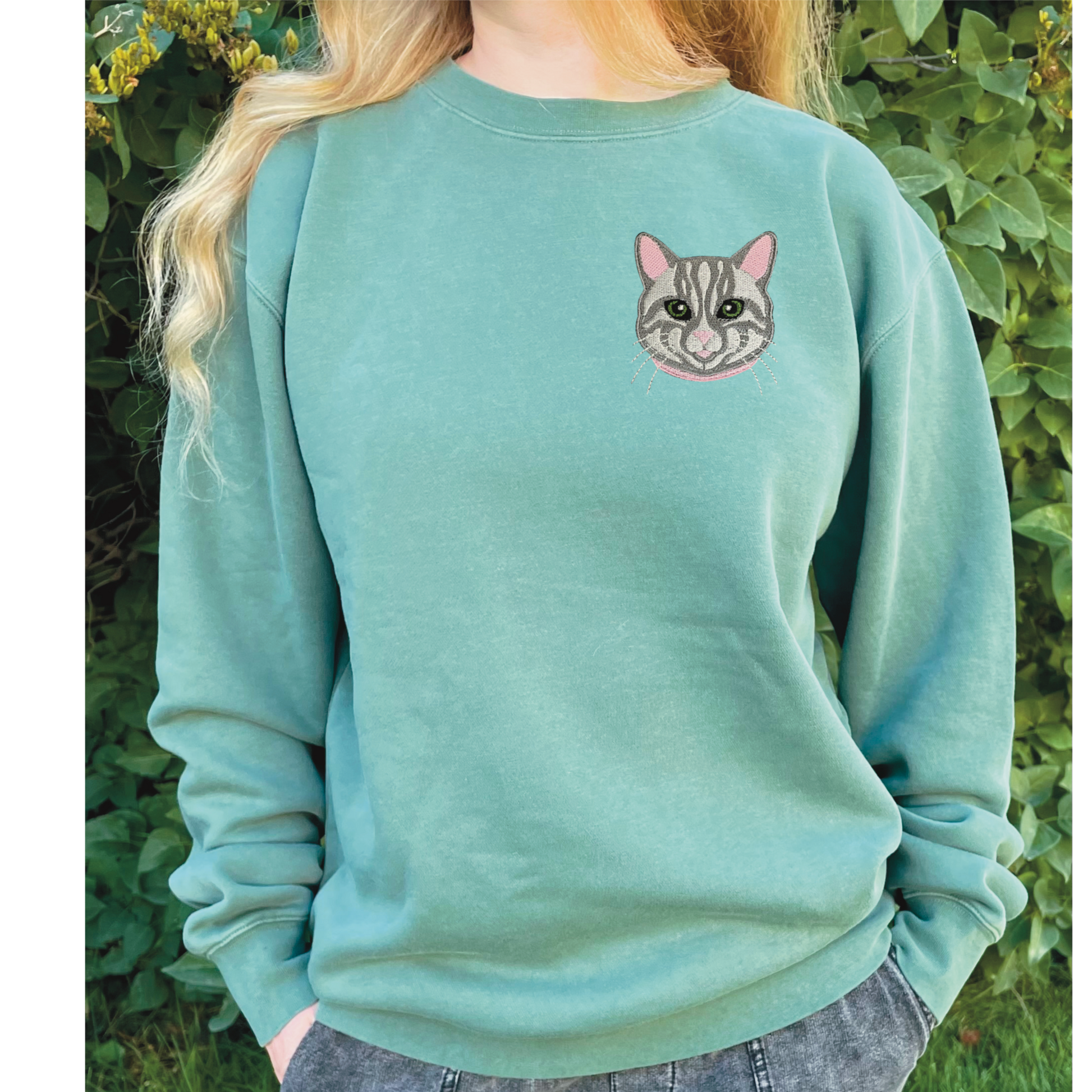 Gray Tabby Cat Embroidered Crewneck Sweatshirt. Design is 4x4 inches left chest. Available in sizes S-3XL on Forest Green Sweatshirt. 