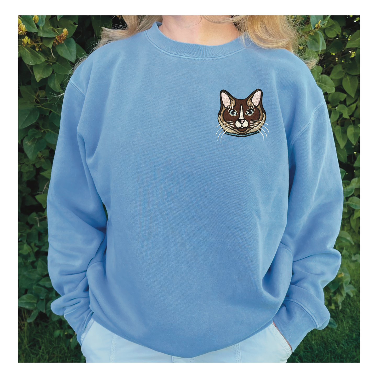 Ragdoll, Snowshoe, Siamese Cat embroidered on a crewneck sweatshirt color pigment baby blue design is 4x4 inches on the left chest. Available in sizes S-3XL.