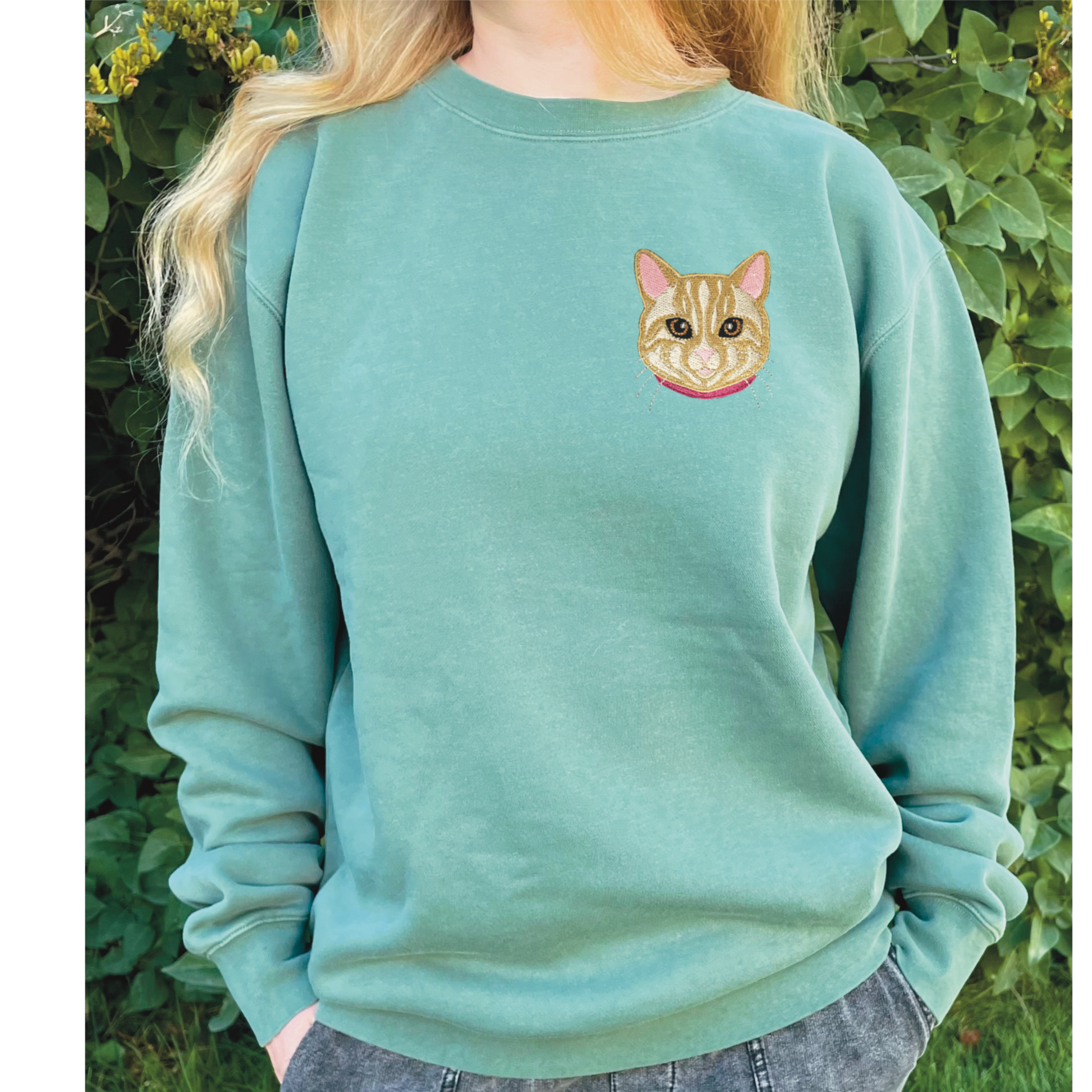 Cream/Tan Tabby Cat Embroidered Crewneck Sweatshirt. Design is 4x4 inches left chest. Available in sizes S-3XL on Forest Green Sweatshirt. 