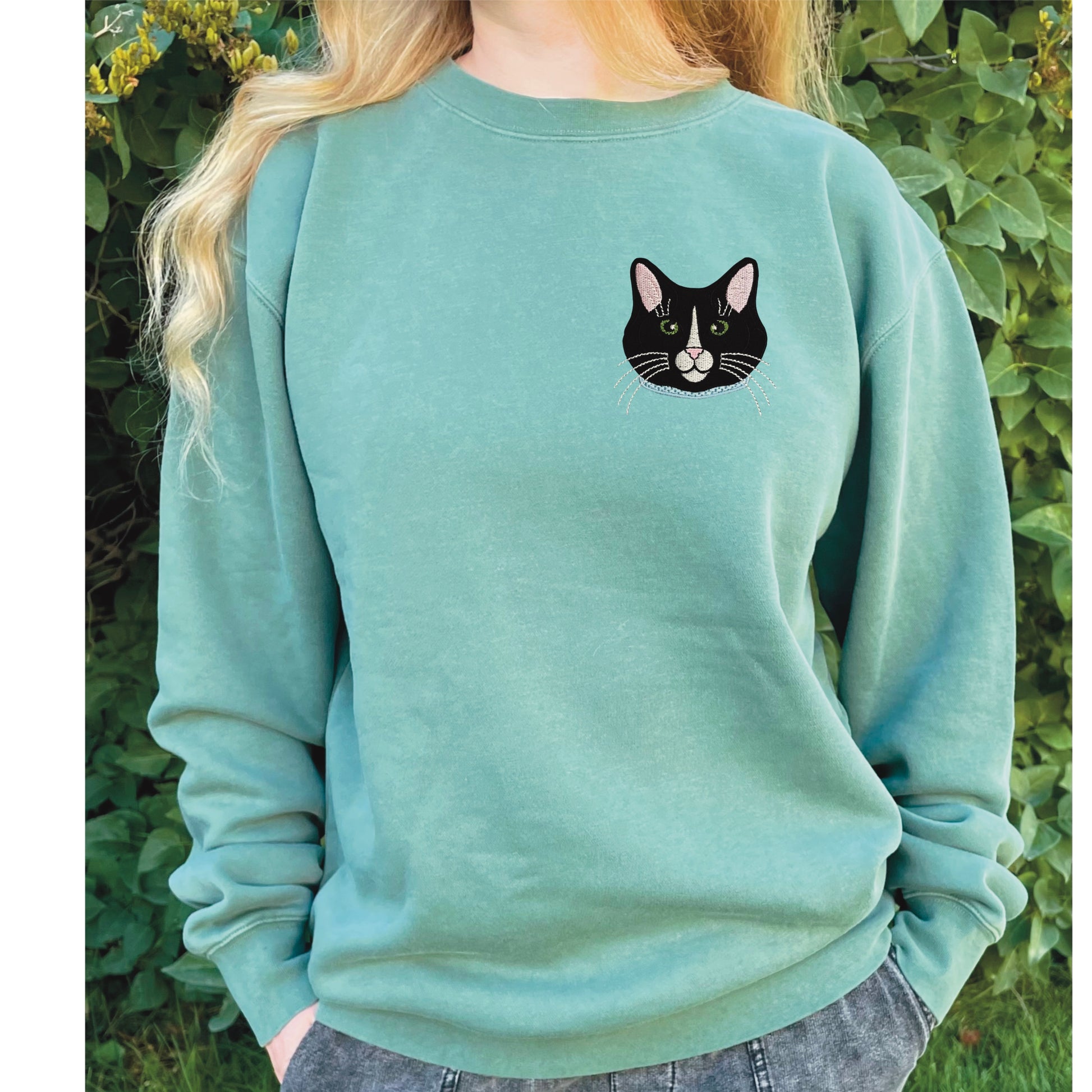Tuxedo Black and White Cat Embroidered Crewneck Sweatshirt. Design is 4x4 inches left chest. Available in sizes S-3XL on Forest Green Sweatshirt. 