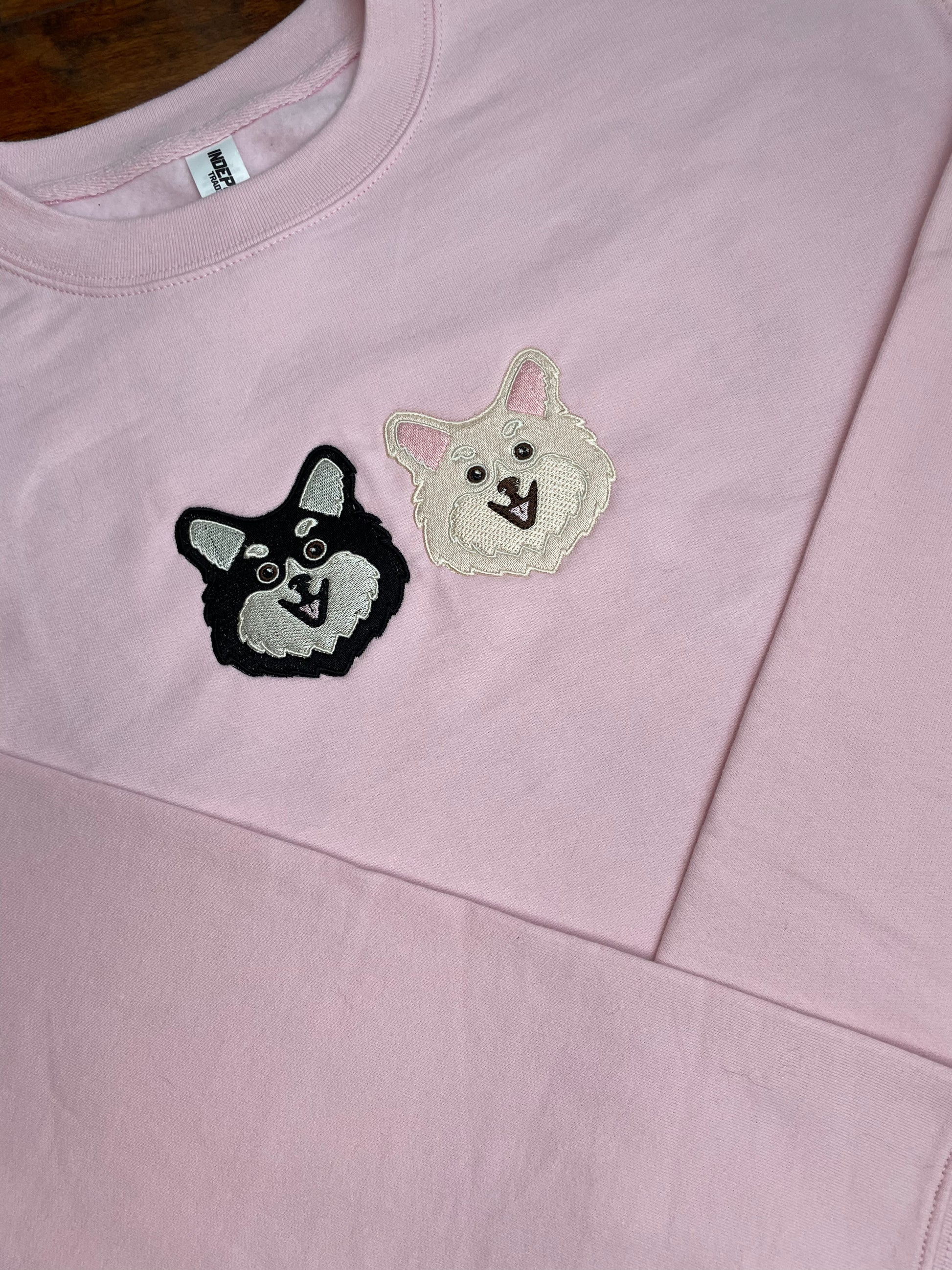 Soft, comfortable, high quality crewnecks. Colors available are pigment pink, baby blue, and forrest green. Personalized with Pomeranian dog breed on front. There are two options available for colors for this dog breed design Black/Cream or Cream/White  (Size 4X4in). Left chest embroidered graphic with a unisex fit, mid-weight fabric.